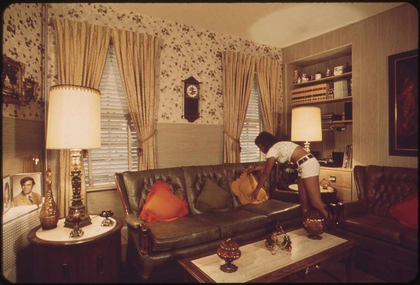 Sandra Bruno straightens out a pillow in the immaculate living room of her family home at 39 Neptune Road, Boston